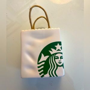 Starbucks collectible ceramic bag ornament.